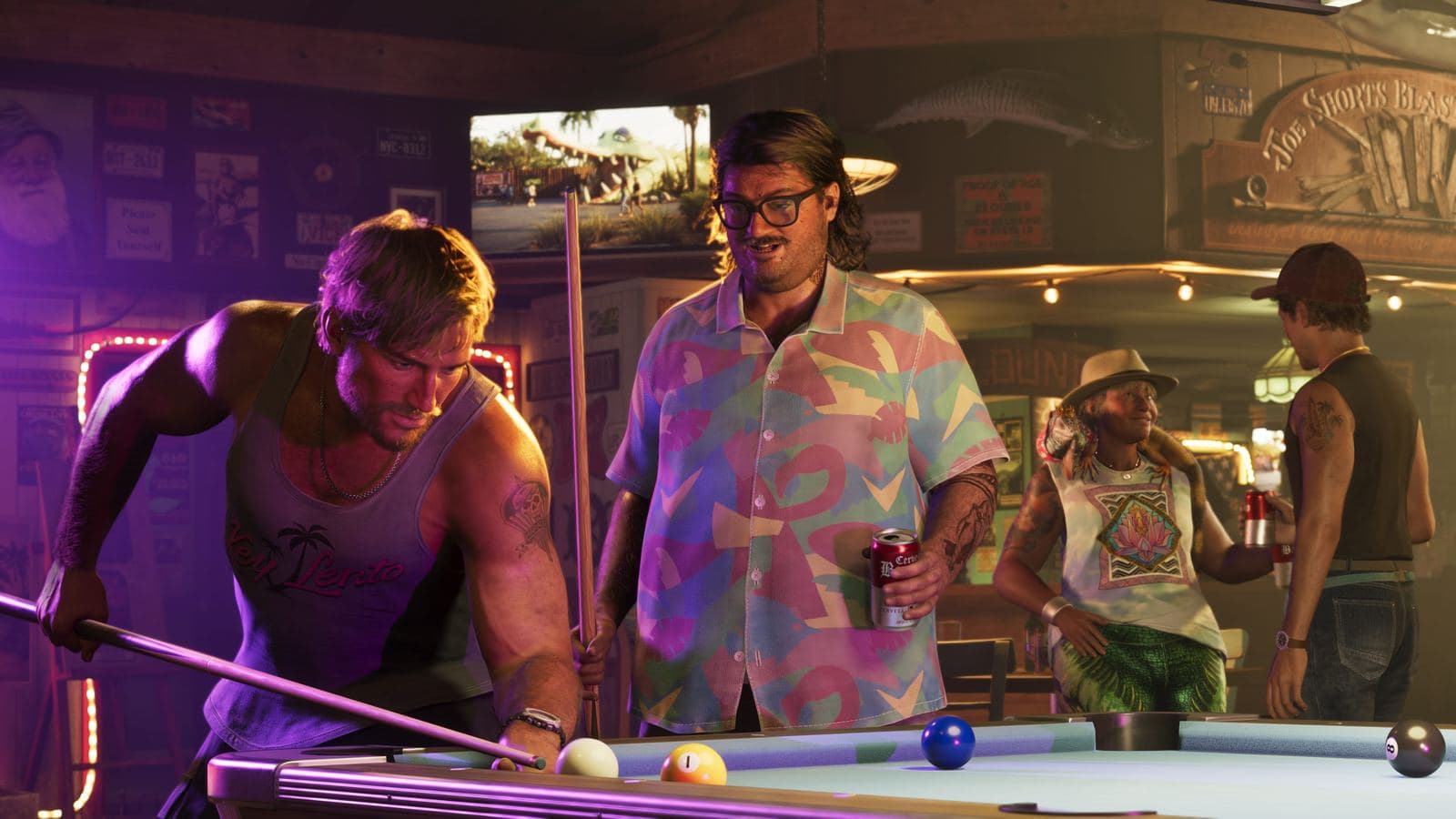 Jason lines up a pool shot as Cal Hampton watches, beer in hand, in a sports bar