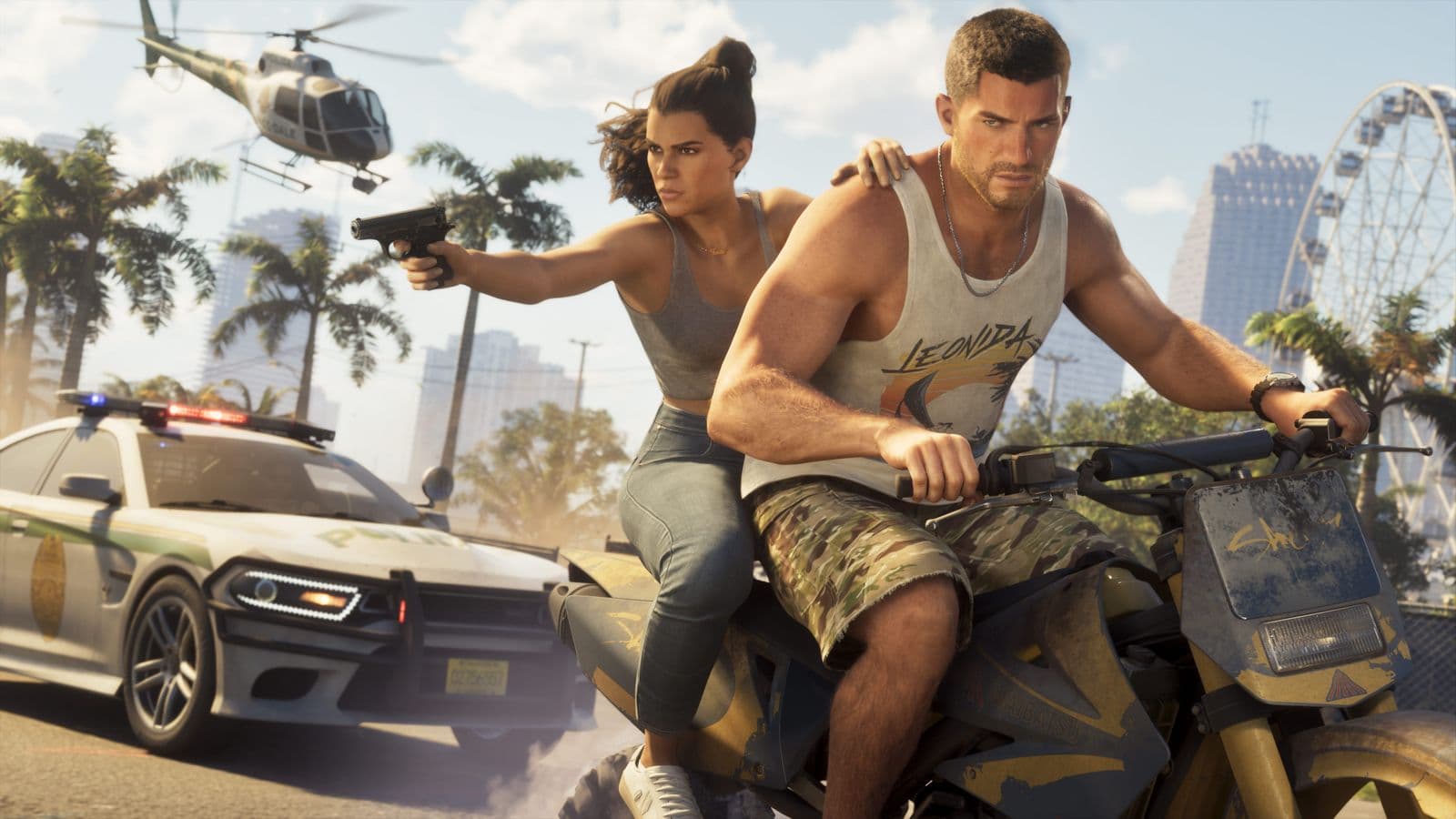 Jason rides a dirt bike with Lucia on the back aiming a pistol as a police car closes in