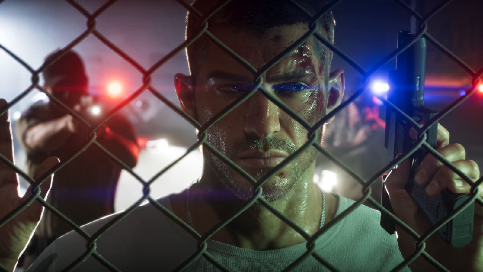 A bruised Jason Duval holding a pistol behind a chain-link fence, police lights behind him