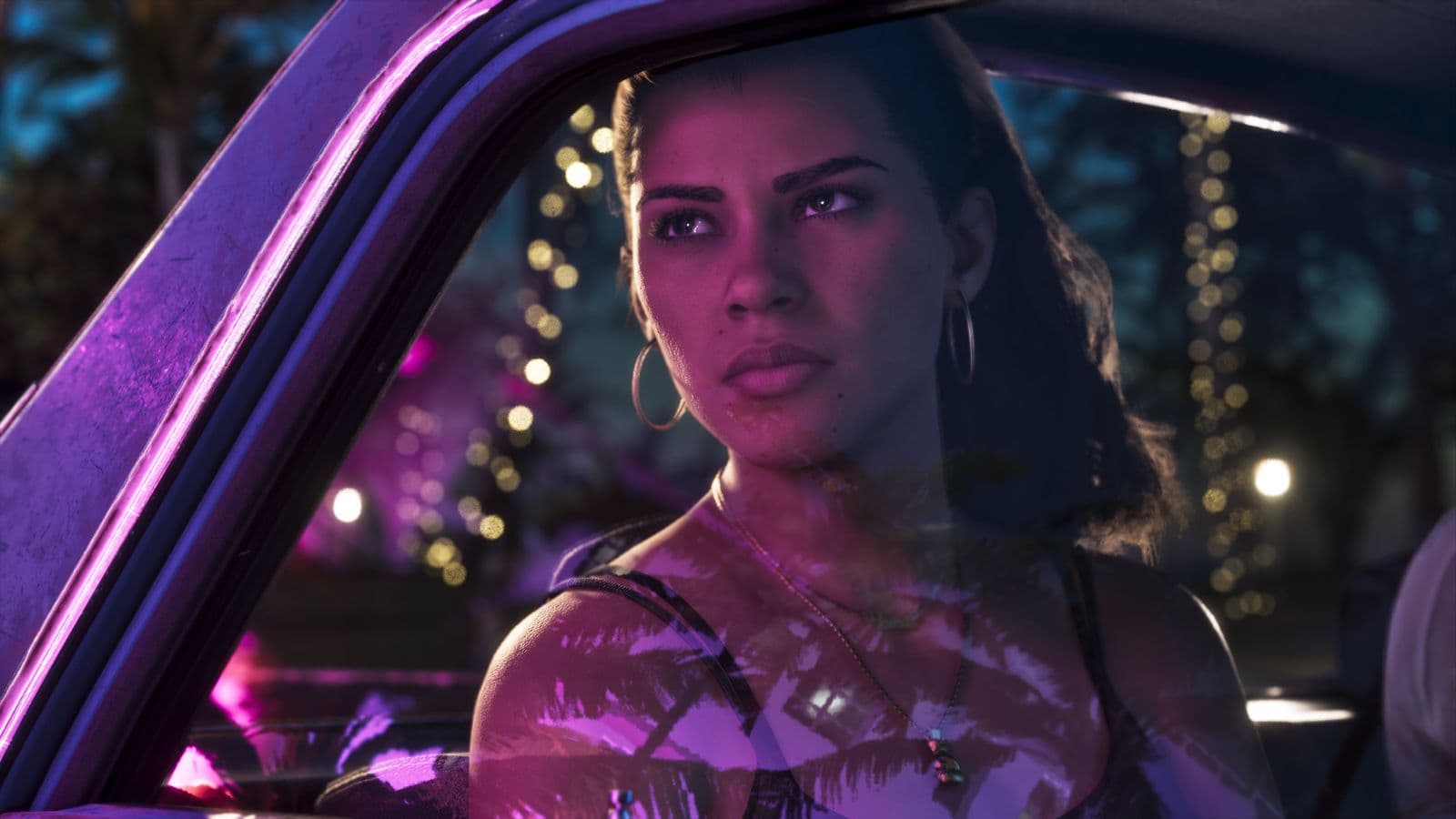 Lucia Caminos looking out of a car window at night under purple neon light