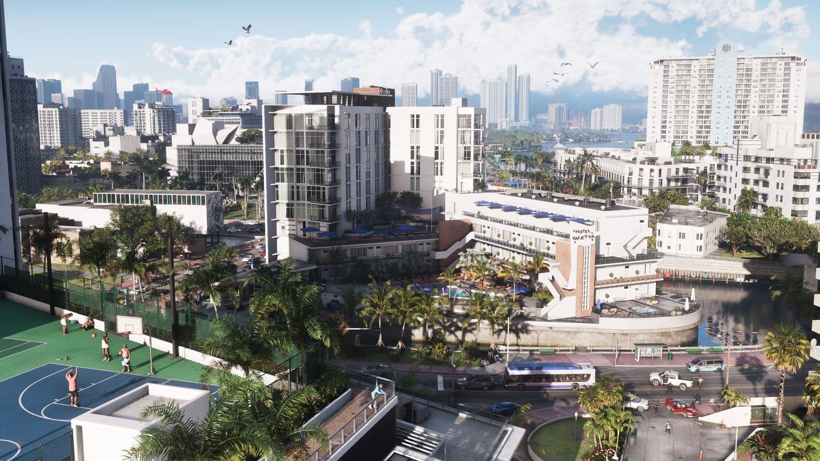 Aerial view over Vice City hotels, palm trees and a basketball court
